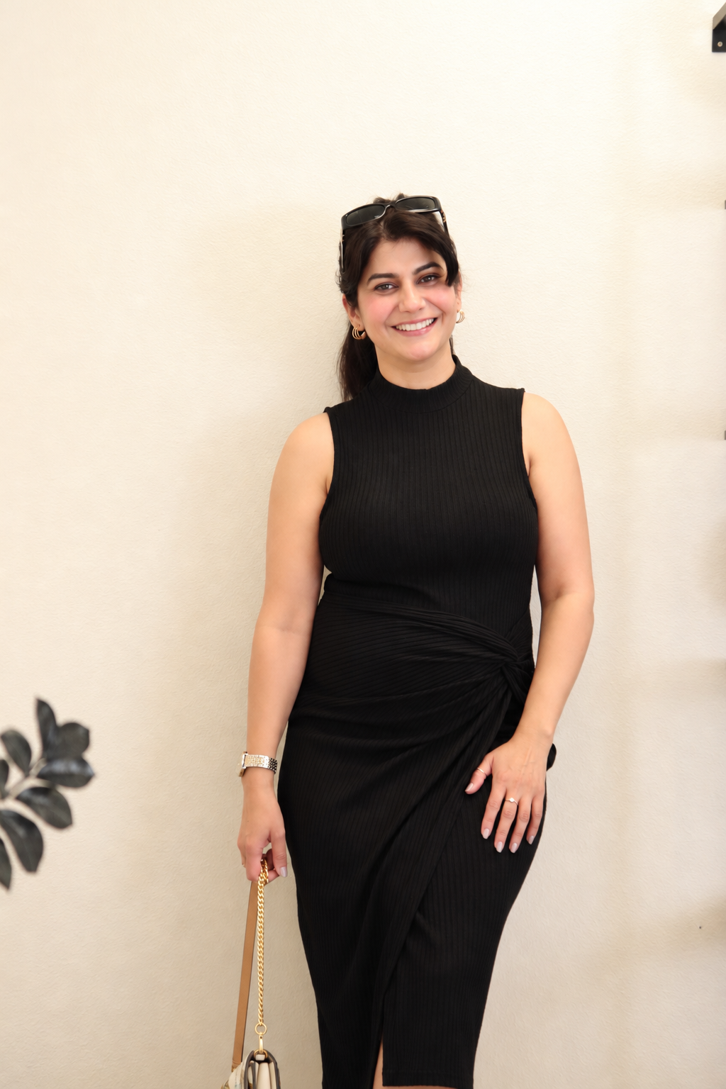 Moon Sheoran smiling in an elegant black dress