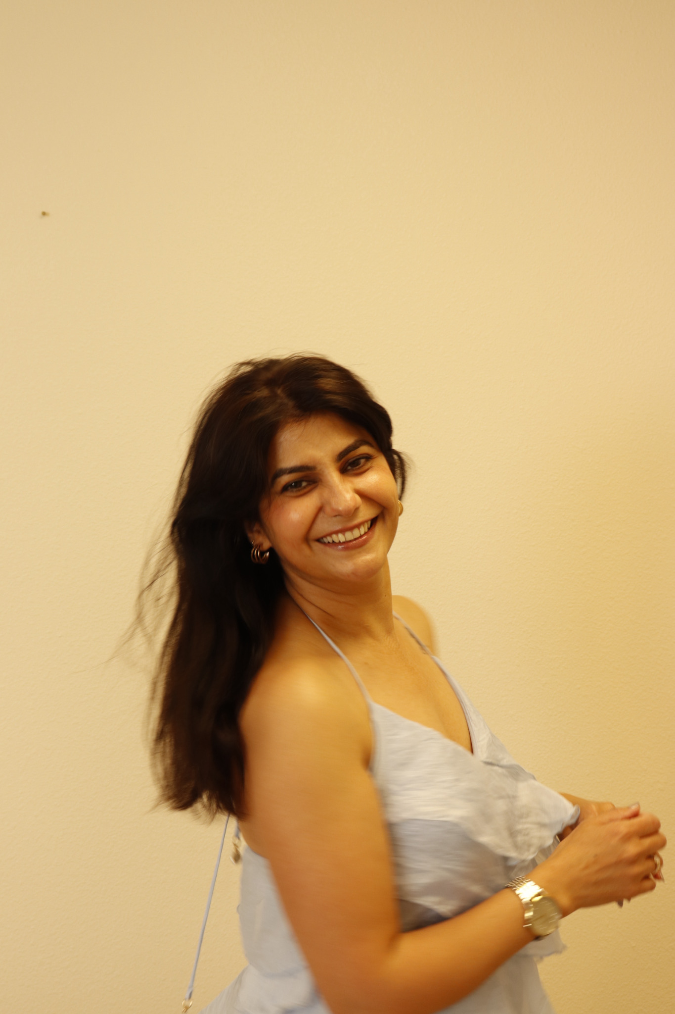 Moon Sheoran smiling in a light blue dress